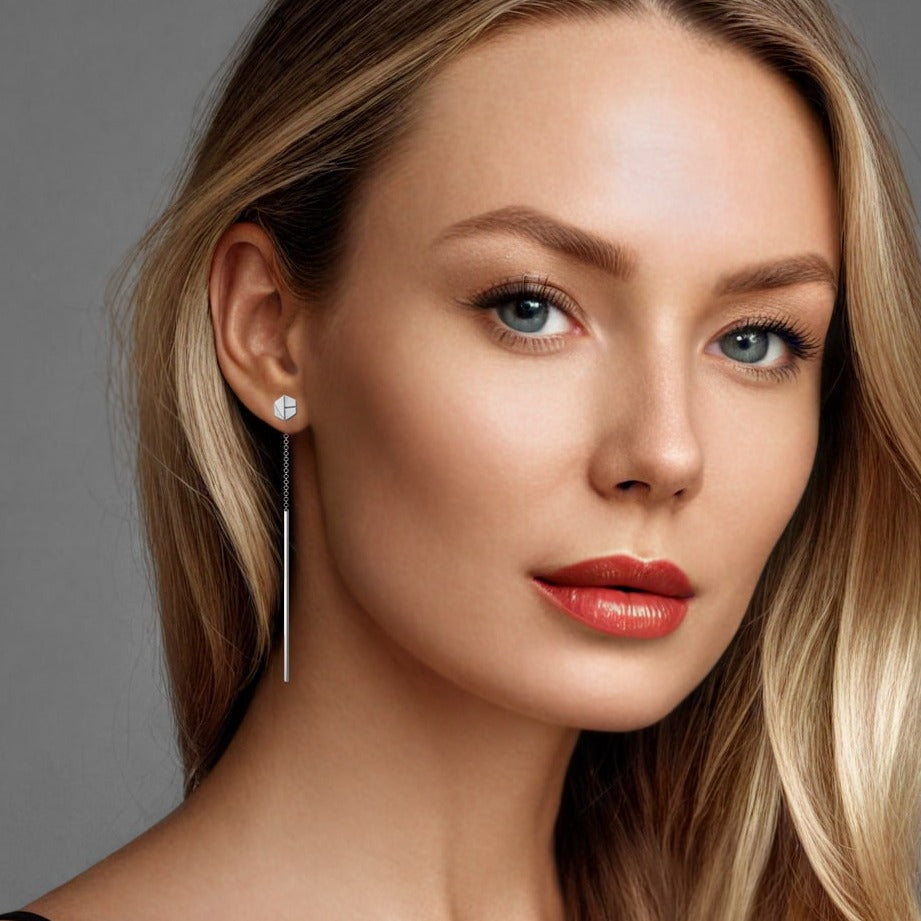 See You threader earrings in 18 karat surge white gold, finely crafted as sustainable jewelry. These earrings capture the essence of ethical luxury, handcrafted artisan jewelry, and modern high-end jewelry design, perfect for those seeking understated elegance with sustainable integrity.